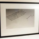 A photograph of a letter mounted in a frame.