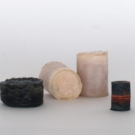 Four cylindrical objects made of salt.