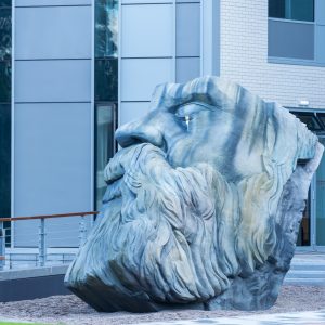 Photograph of an outdoor sculpture of the head of Friedrich Engels.