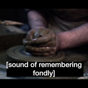 A still from an artists' video. Three identical images are shown side by side. They show a pair of hands sculpting a piece of clay on a potters wheel. Each image has a different text caption written in white text. The first reads 'holding', the second reads 'sound of remembering fondly' the third just has three asterisk * stars
