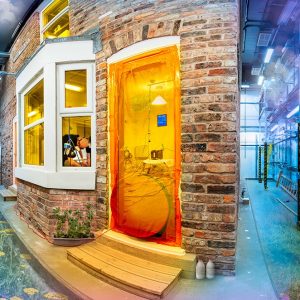 a photographic composite showing a traditional, brick-build Victorian terrace. The image is altered to show hot and cold spots