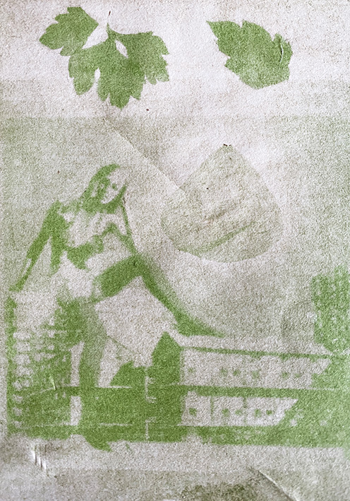 Anthotype image of woman sat on top of buildings surrounded by leaves