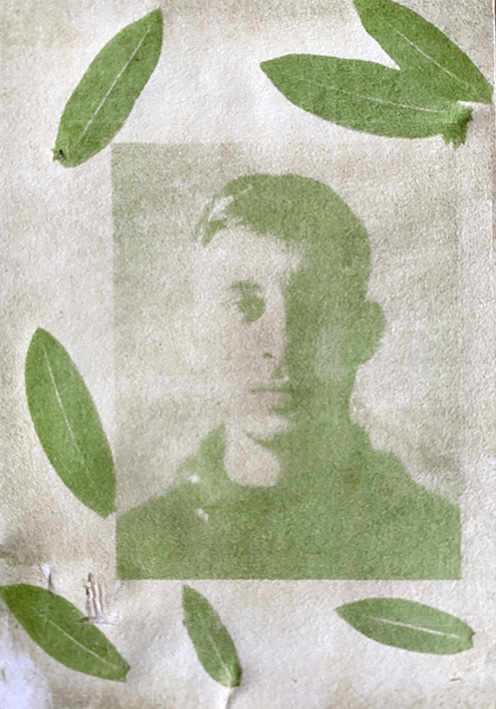Anthotype image of a young man surrounded by leaves