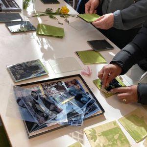 A photograph showing two people making their own anthotypes