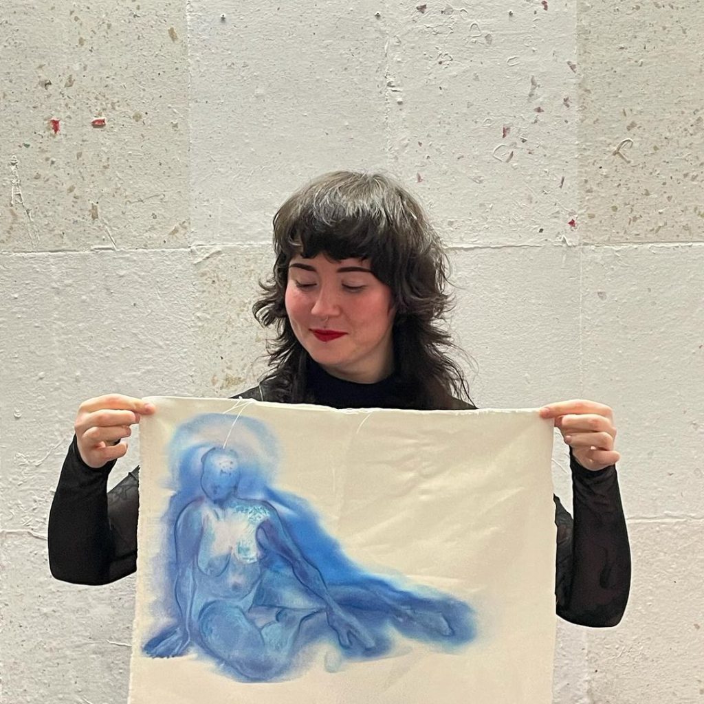 Graduate Scholar Megan Brierley presenting a satin painting/ pastel workshop at the University of Salford.