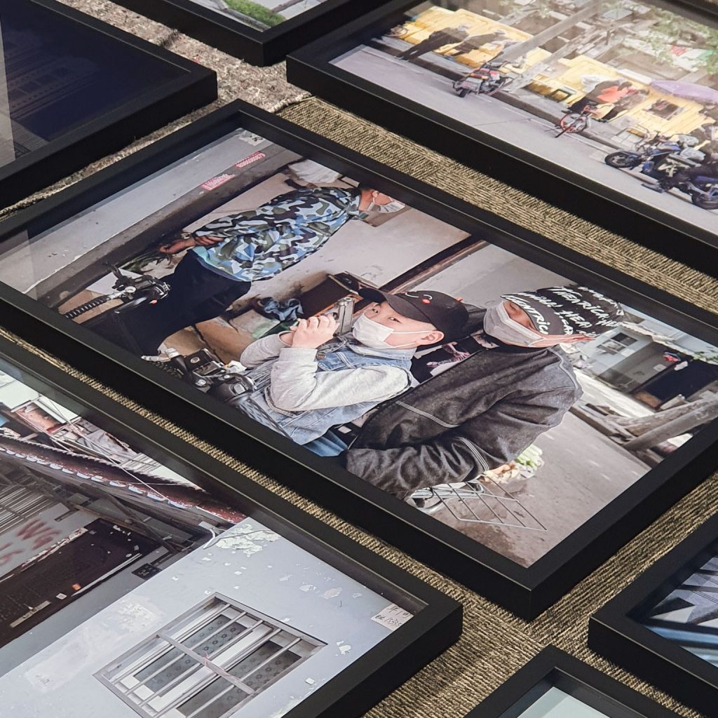 An close-up photograph of Wue Yue's "a transparent separation" photographs series during the install of the 'Mediated Realities' exhibition in the New Adelphi Exhibition Gallery.