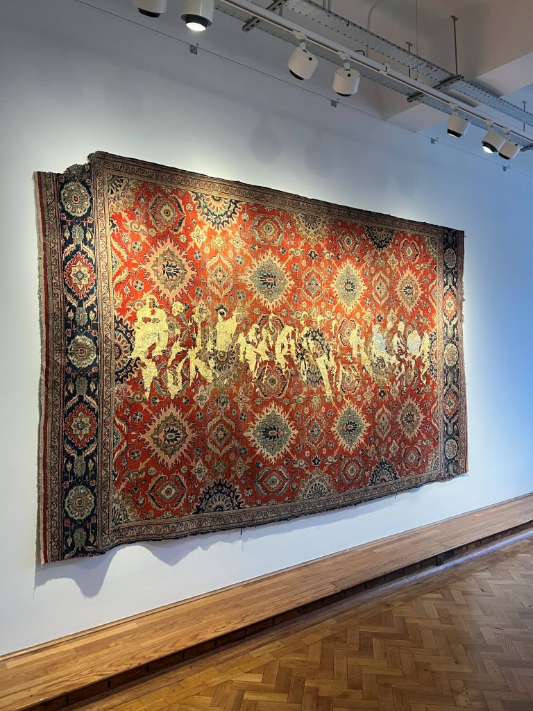 Textile artwork installed in gallery space