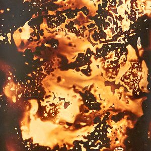 Black and orange photographic print, with liquid effect.